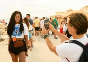 Professor Tatiana Kolvou takes a photo of a Kelley Direct student at the Acropolis during the global immersion to Greece
